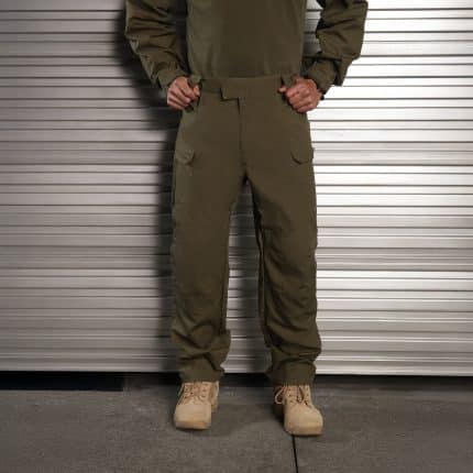 A man wearing TUXAPO army green tactical pants