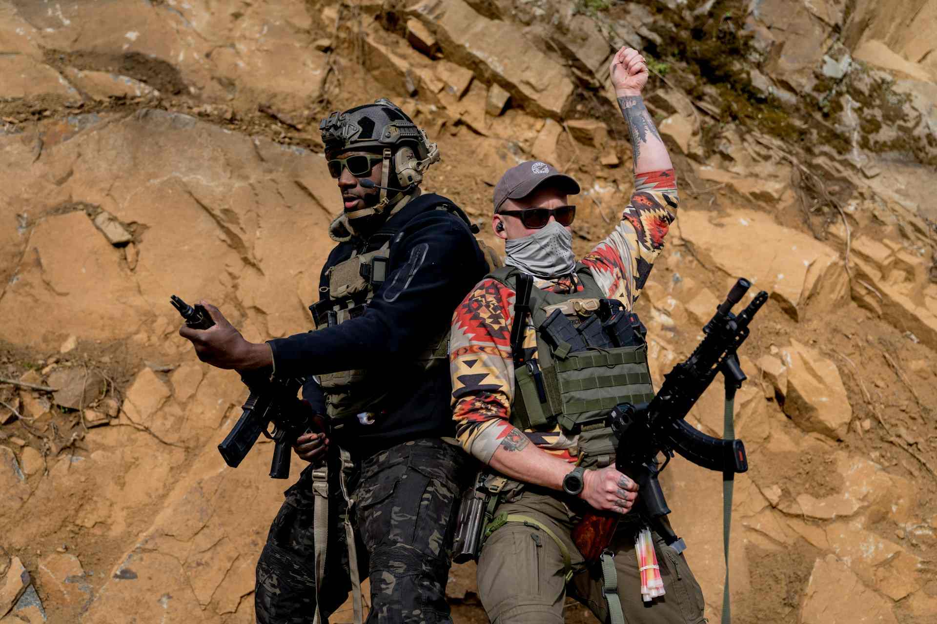 Guys wearing plate carriers with accessories and attachments